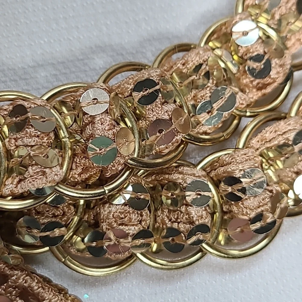 Vintage belt, gold rings, open weave fabric, sequins galore!  Glam!!